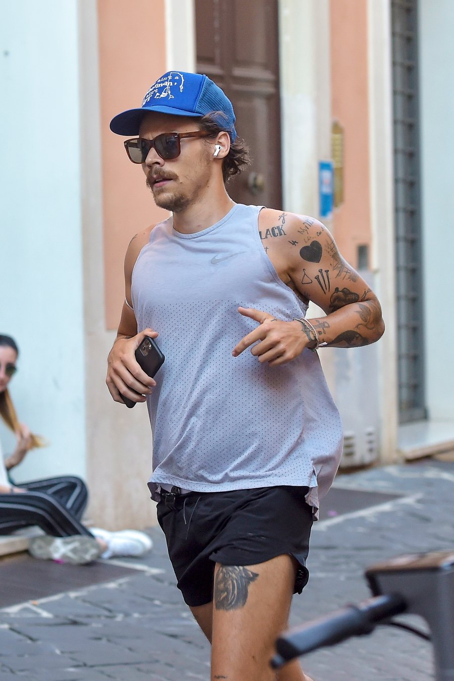 Harry Styles' 70s-Inspired Mustache: A London Appearance Harry Styles' 70s-Inspired Mustache: A London Appearance