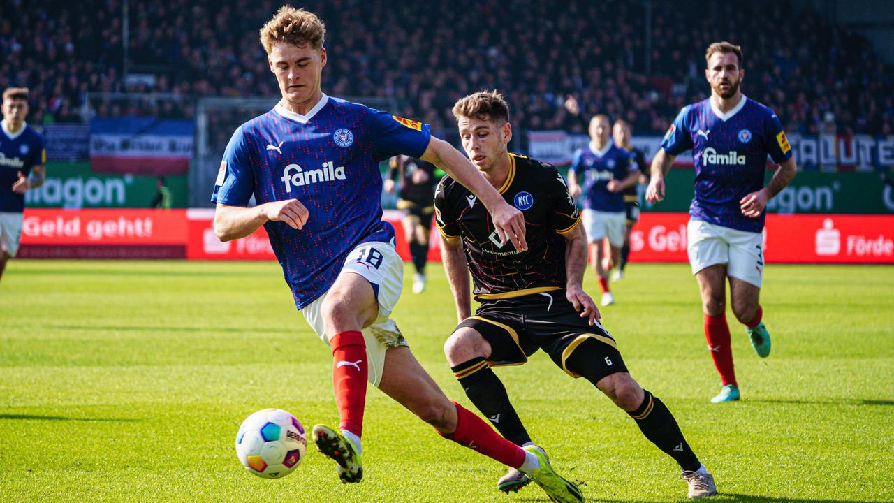 Relegation-Threatened Holstein Kiel Earns Vital Draw Against Champions League-Chasing Mainz Relegation-Threatened Holstein Kiel Earns Vital Draw Against Champions League-Chasing Mainz